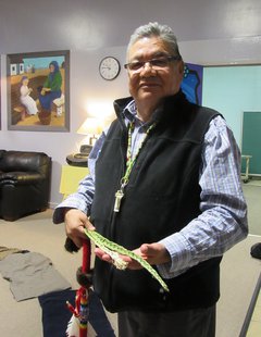 Wally Awasis holds traditional sweetgrass