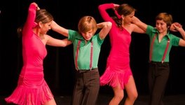 A group of kids, including N’Tanis and Kori Wuttunee, Salsa dancing.