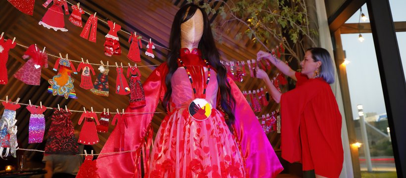 A photo of the Many Red Dresses exhibit, which recognized Murdered and Missing Indigenous Women and Girls, that was part of the Nuit Blanche Saskatoon festival during Culture Days.