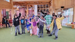 A photo of a Indigenous-Immigrants Heritage learning event, where newcomer youth learned about Indigenous traditional dances during an excursion to Wanuskewin Heritage Park.