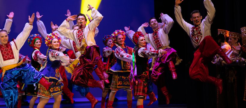Volunteer performers dancing on a stage at the United for Ukraine concert.