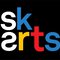 The SK Arts text logo set on a black background.