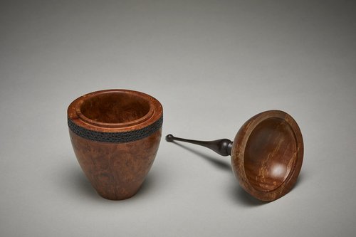 A wooden vessel entitled "Finial Finale" by Dave Dunkley.