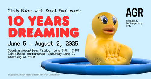 In the image is a huge, inflated yellow duck chair that looks like a giant rubber ducky beach toy.