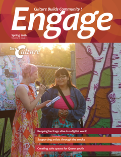 The cover of this issue of Engage. The cover photo shows two young people posing in front of a colourful mural. One of them is holding up a microphone, speaking.