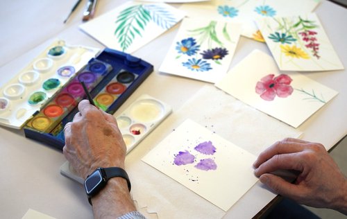 Photo of someone painting watercolor