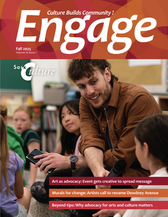 The cover of this issue of Engage. The cover photo shows a man seated in the floor of a classroom, holding up a microphone for a young student to use.