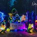 Photo of glowing dancers with sign that says Free Flow Dance.