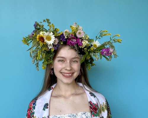image of a woman wearing a vinok (Ukrainian flower crown)