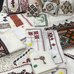 An image of various Ukrainian style embroidered items with price stickers.