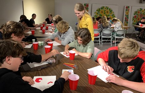 group of kids painting petrykivka