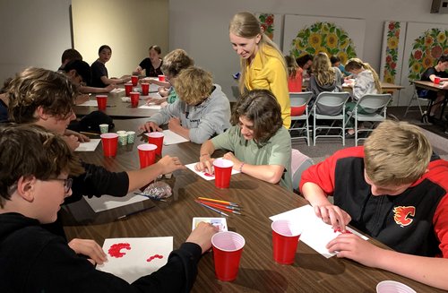 group of kids painting petrykivka