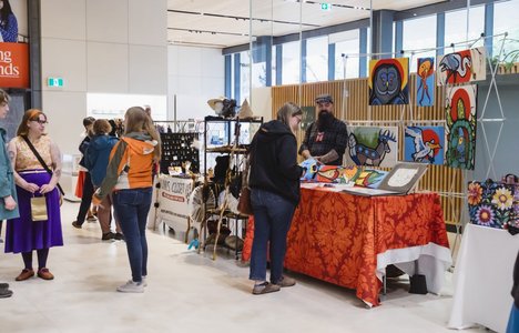 Attendees to last year's Metis Market browse booths in the atrium of Remai Modern.