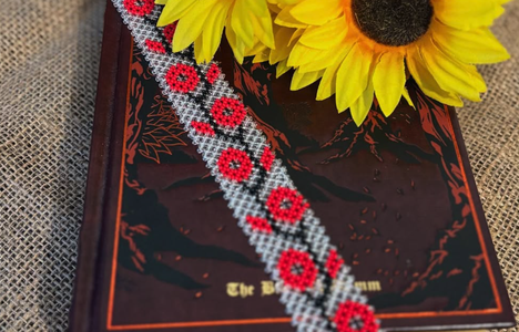 image of white Ukrainian beaded bracelet with red flowers