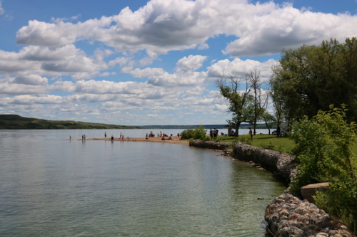 Image of people playing in a lake
