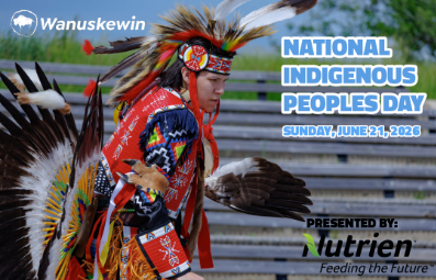 Photo of a Indigenous man in Traditional Indigenous Dress dancing at a Powwow.