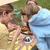An image of a an adult female showing to children a crafting activity. Details of the Yorkton Culture Days is also mentioned on the poster.