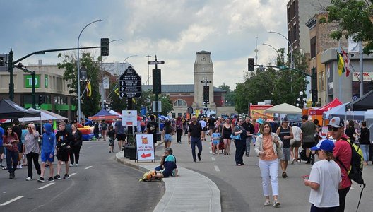 A photo of a group of people out on the streets during the Sidewalk Days 2024 event in Moose Jaw