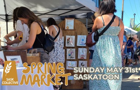 picture of an outdoor market scene with women in sundresses looking at a booth with art prints