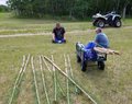 Trees_cut_and_limbed_for_tipi_poles._Taking_rest_before_peeling_the_poles._Day_was_hot.