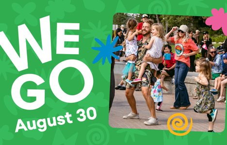 WEGO attendees dance in the river landing amphitheater.