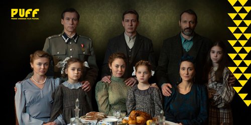 An image from the film Shchedryk (2022) which will be screened at PUFF this year. The image shows three families sitting/standing around a table.