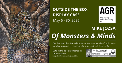 A piece of antique wood has been carved and painted to show Godzilla, emerging from the sea and holding a ship.