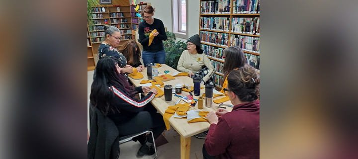 A group photo of people at an Indigenous Storytelling Month event.