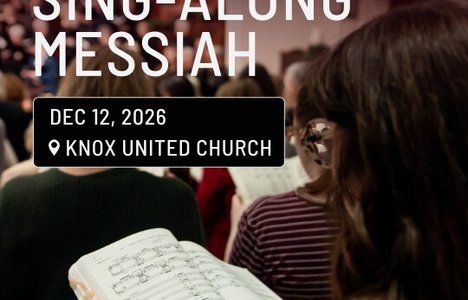 Photo of a person reading from a hymn book.