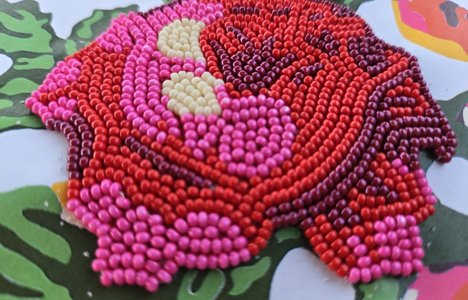 image of a red and pink beaded flower