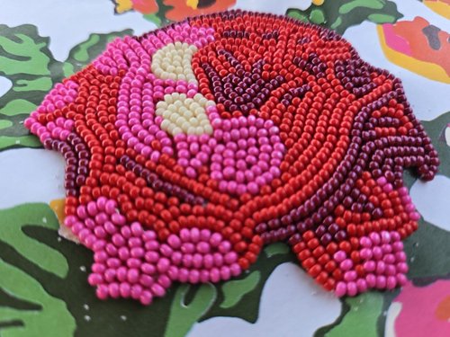 image of a red and pink beaded flower