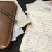 An old love letter is displayed, along with a stationery case